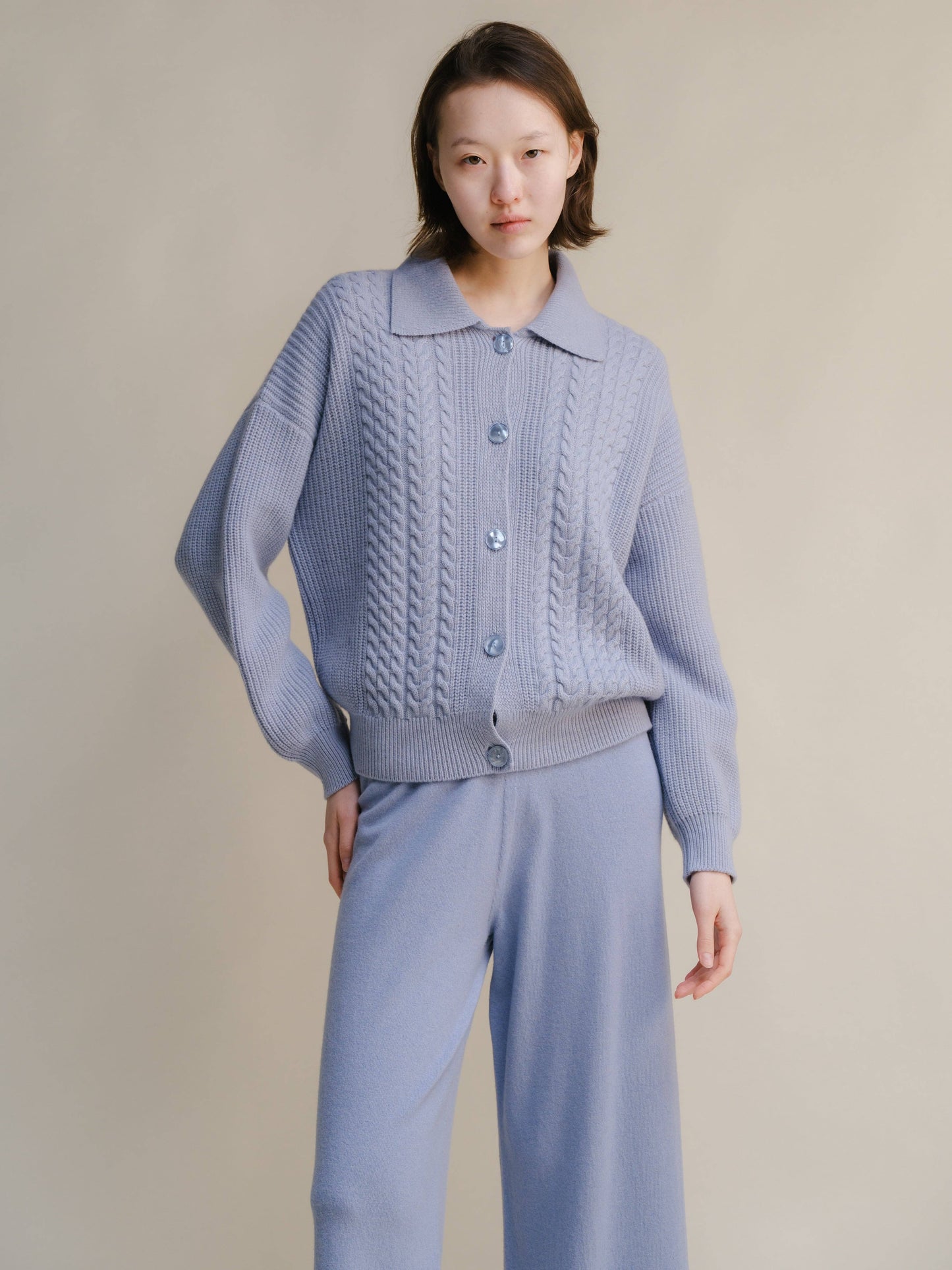 Cardigan polo in misto cashmere con trecce