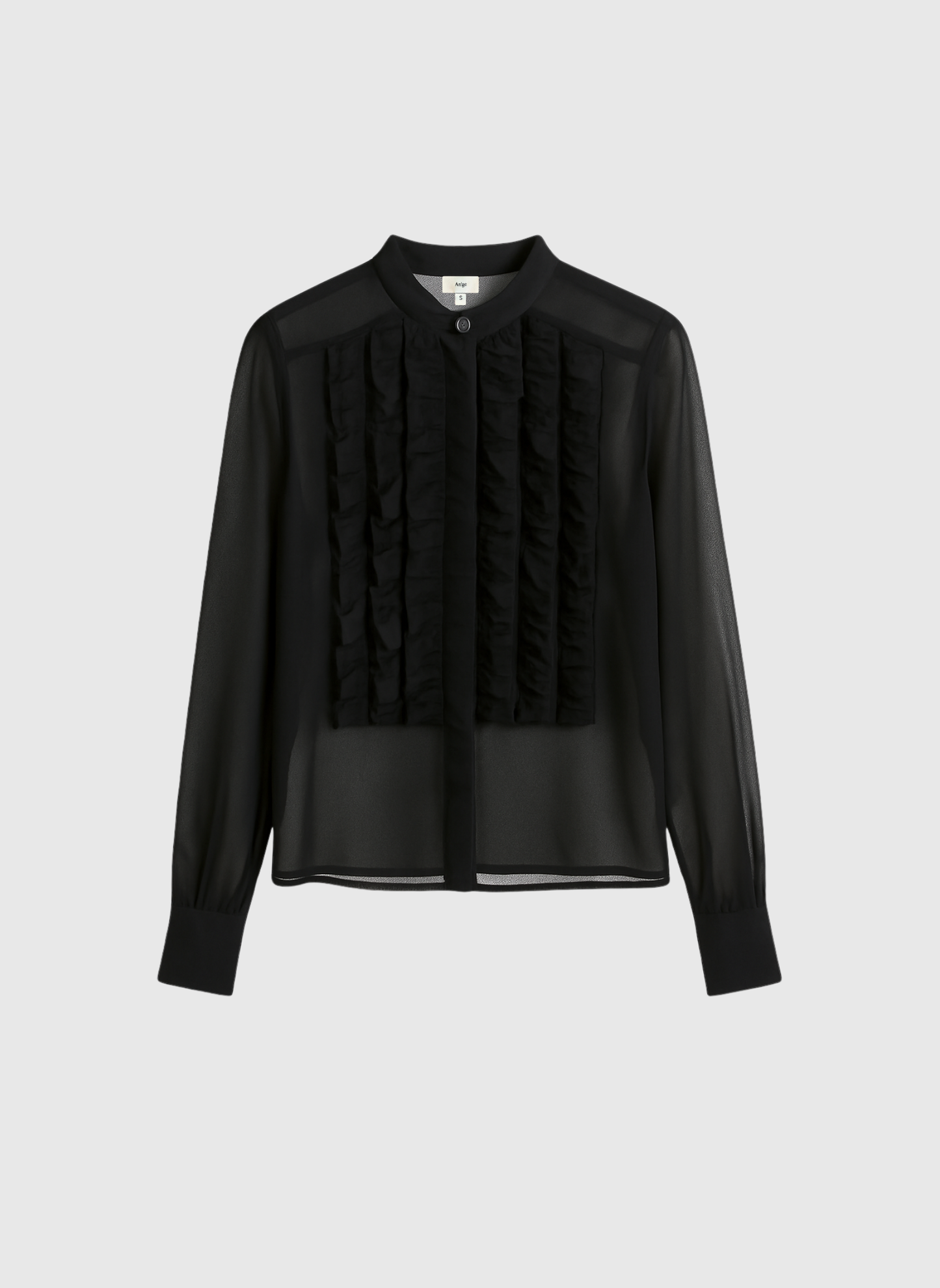 Blusa nera trasparente con volant