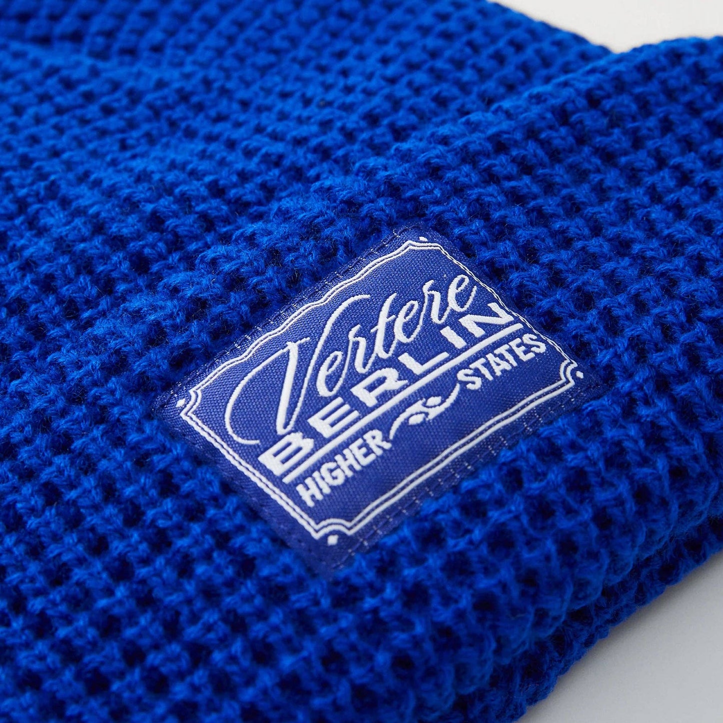 Berretto corto a nido d’ape con patch logo