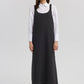 Abito salopette nero con spalline strutturate