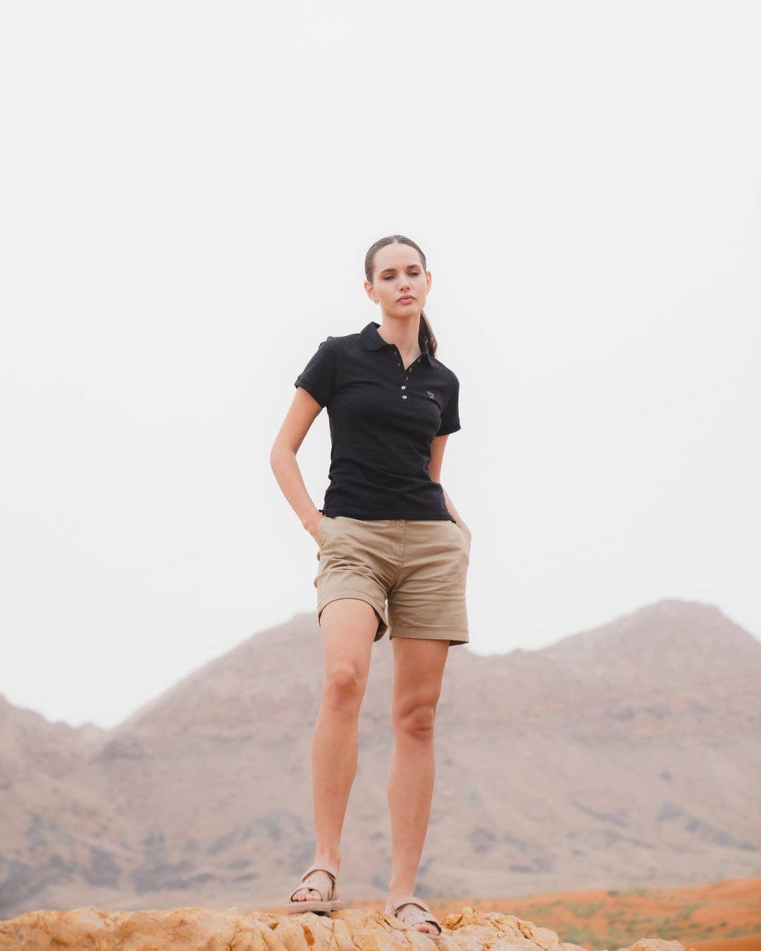 Polo donna nera in piqué antimacchia