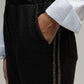Pantaloni Pierroly effetto pelle neri con bande argento