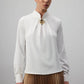 Tunica in lino ecrù con spilla a rosa