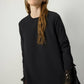 Tunica in crêpe nera con polsini in chiffon trasparente
