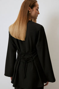 Blusa in crêpe con incrocio