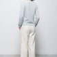 Pantaloni dritti minimal con tasche oblique