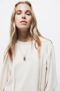 Blusa con pieghe e maniche a palloncino