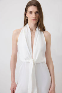 Tuta halter ecrù con fiocco frontale