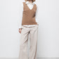 Gilet in maglia strutturata a trecce con scollo a V