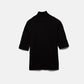 Maglione a maglia rasata con maniche a tre quarti e collo alto