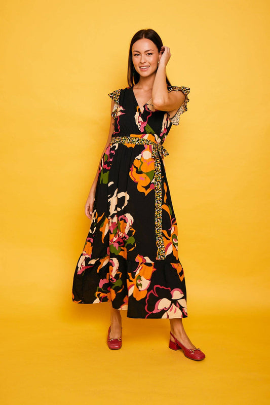 Abito lungo incrociato nero floreale con volant