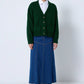 Cardigan in maglia verde con tasche e bottoni