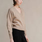 Maglione corto tweed con doppio scollo a V