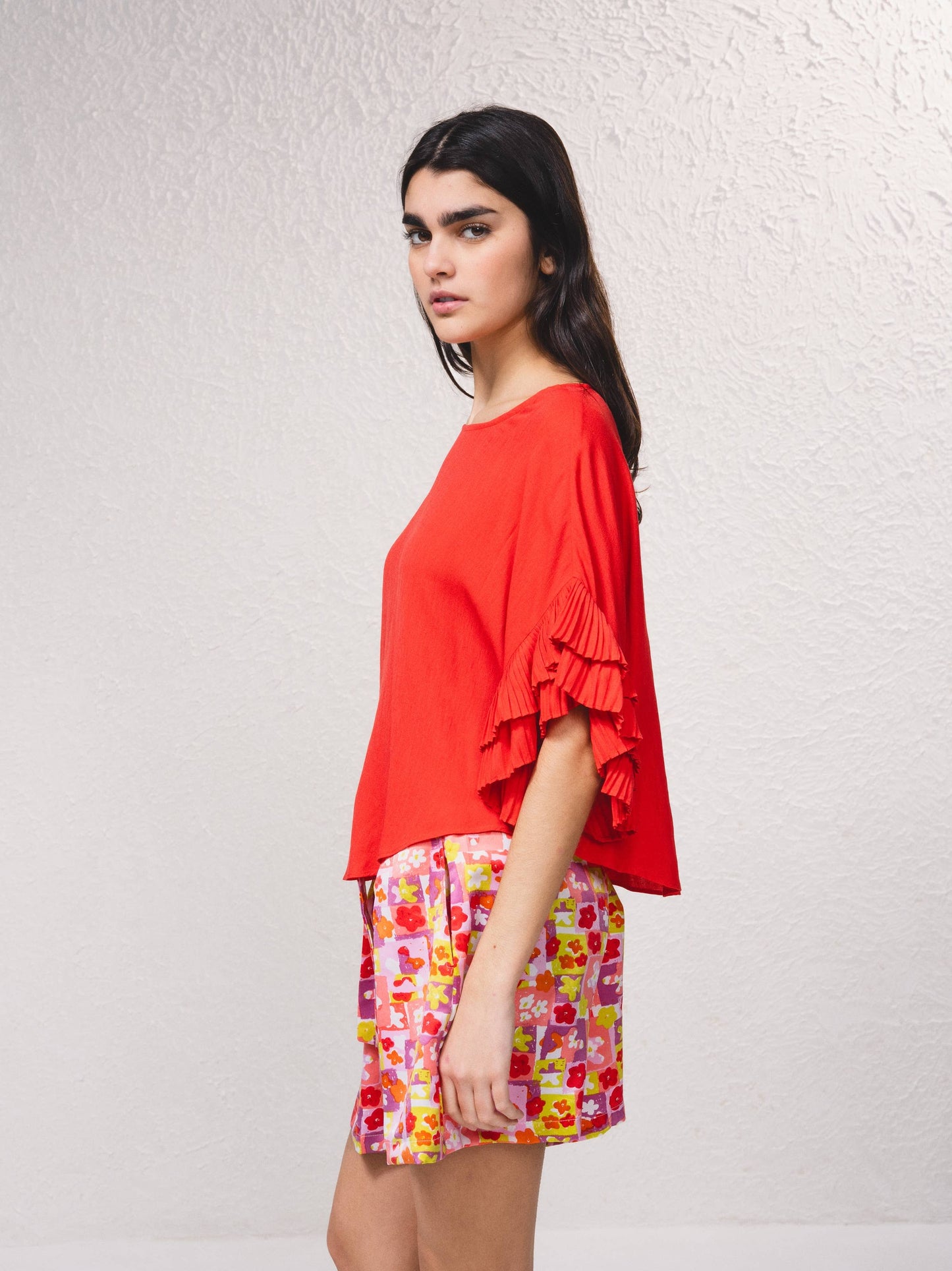 Blusa fluida con maniche a volant plissé