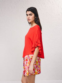 Blusa fluida con maniche a volant plissé