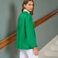 Tunica jacquard verde con fiocco al collo