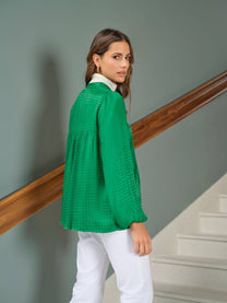 Tunica jacquard verde con fiocco al collo