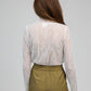 Top in pizzo bianco a maniche lunghe con collo alto
