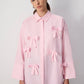 Camicia oversize in cotone a righe rosa con fiocchi