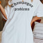 T-shirt oversize grafica “Champagne Problems”