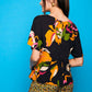 Camicia nera a maniche corte con stampa floreale e bottoni sul retro