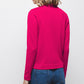 Maglione in maglia rasata con fiocco e scollo a V