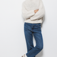 Maglione a trecce con collo alto