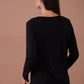 Blusa nera con stelle glitter e scritta