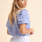 Blusa floreale in viscosa con volant