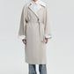 Trench oversize con maniche raglan e cintura