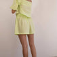 Top corto verde lime in cotone biologico con maniche a sbuffo