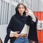 Poncho a coste asimmetrico in maglia morbida