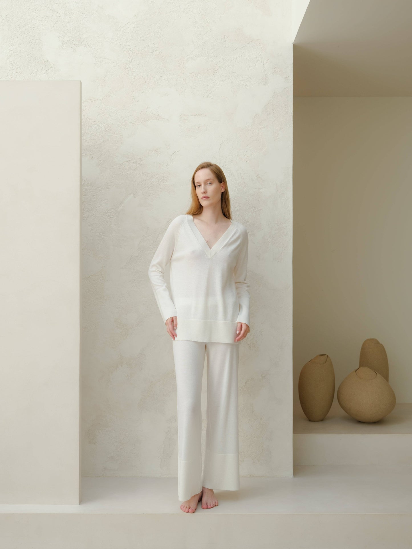 Maxi maglione in lana merino extra fine con scollo a V