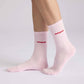 Calzini rosa con scritta “Amore”