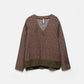 Blusa geometrica con scollo a V