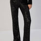 Pantaloni a zampa con paillettes