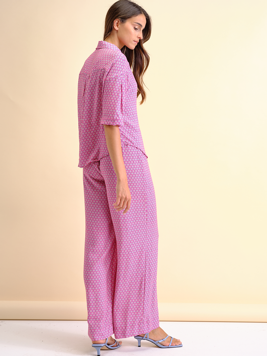 Blusa stampata con bottoni a cuore