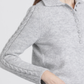 Polo in maglia con maniche a treccia