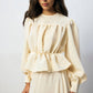 Set coordinato crema con blusa peplo e gonna maxi