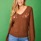 Maglione con scollo a V ricamato beige