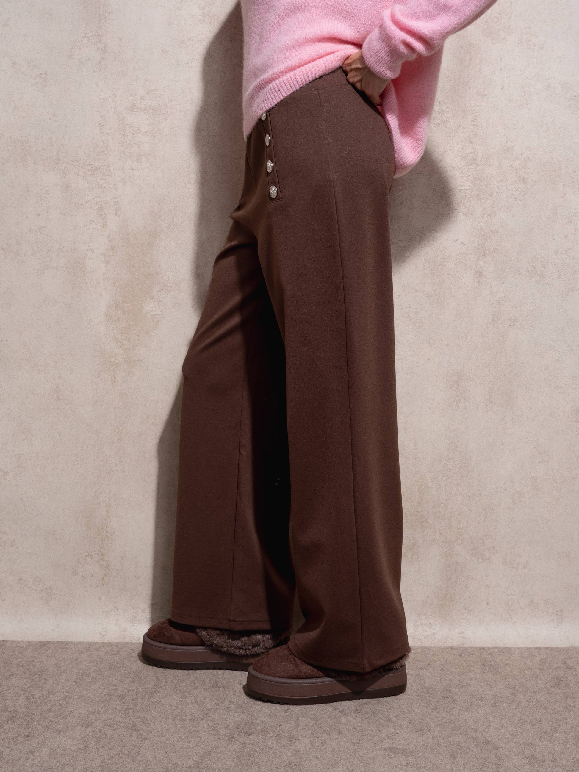 Pantaloni a palazzo a vita alta con bottoni decorativi