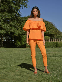 Top off-shoulder con volant in popeline