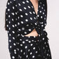 Blusa satinata a pois con fiocco