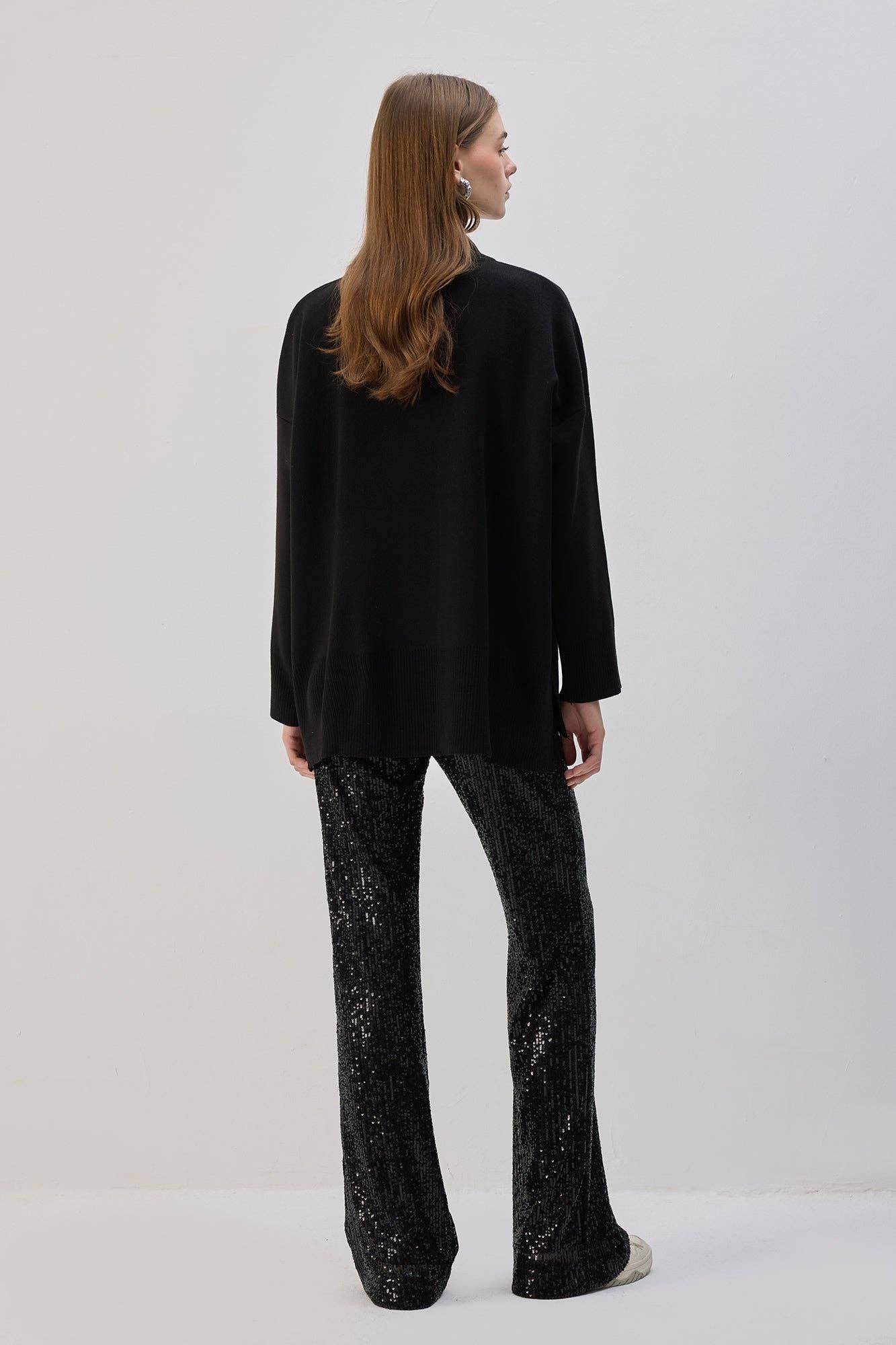 Pantaloni a zampa con paillettes