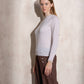 Maglione in maglia con collo alto e volant