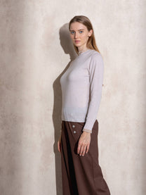 Maglione in maglia con collo alto e volant