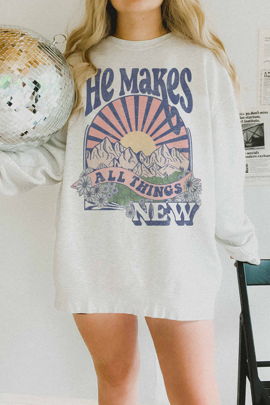 Felpa oversize grafica “He Makes All Things New”