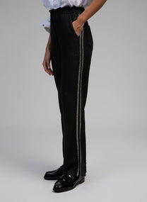 Pantaloni Pierroly effetto pelle neri con bande argento