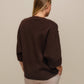 Maglione oversize con scollo a V e bottoni gioiello