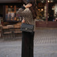 Cardigan animalier in maglia con bordi neri